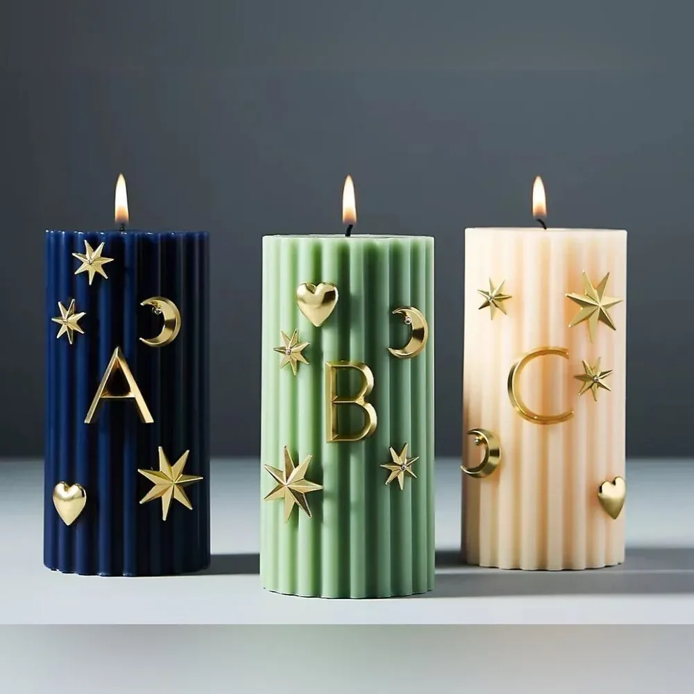 Anthropologie Gold Star and Moon Candle Charms
